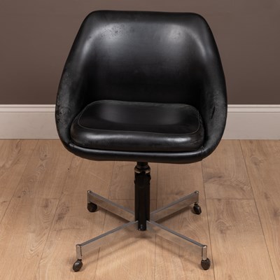 Lot 139 - A mid-century black vinyl swivel pod chair in the manner of Overman