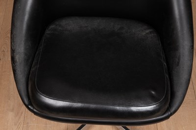 Lot 139 - A mid-century black vinyl swivel pod chair in the manner of Overman