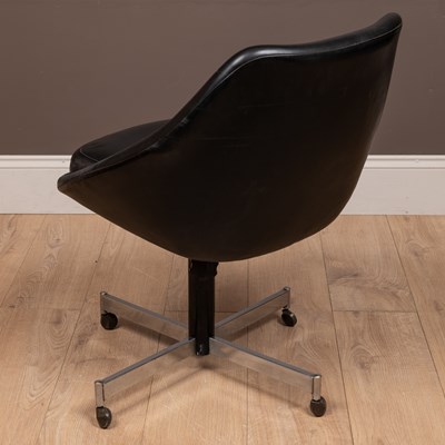 Lot 139 - A mid-century black vinyl swivel pod chair in the manner of Overman