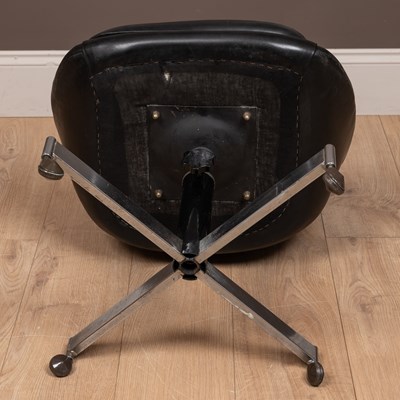 Lot 139 - A mid-century black vinyl swivel pod chair in the manner of Overman