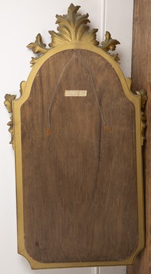 Lot 75 - Giltwood rococo wall mirror with a panel...