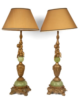 Lot 521 - A pair of gold-painted and green table lamps