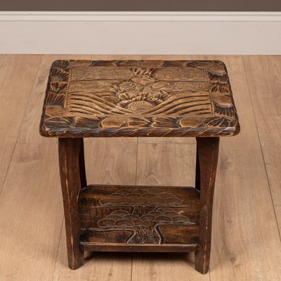 Lot 132 - A small Liberty & Co. carved table