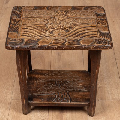 Lot 132 - A small Liberty & Co. carved table