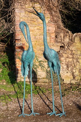 Lot 1253 - A pair of green patinated garden sculptures of storks