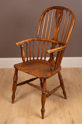 Lot 1061 - An antique ash and elm Windsor armchair