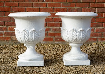 Lot 1311 - A pair of white-painted reconstituted stone garden urns