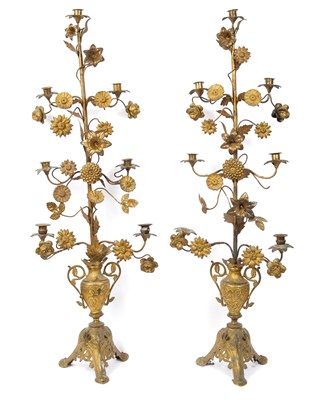 Lot 1121 - A pair of Continental gilt metal seven-light candelabra