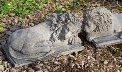 Lot 1164 - A pair of recumbent lions