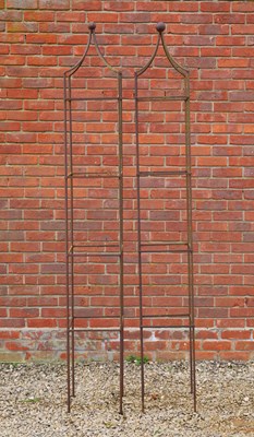 Lot 1261 - A pair of wrought-iron garden obelisks