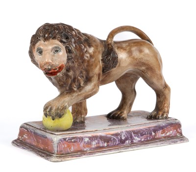 Lot 1044 - A 19th century Staffordshire pottery figure of a Medici lion