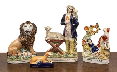 Lot 257 - Four Staffordshire figures including lion and...