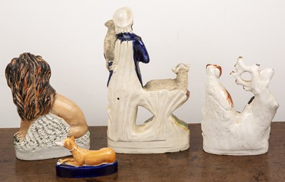 Lot 257 - Four Staffordshire figures including lion and...