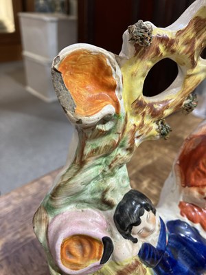 Lot 257 - Four Staffordshire figures including lion and...