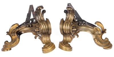 Lot 275 - A pair of antique Rococo style cast brass chenets