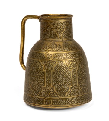 Lot 1168 - An antique brass Islamic Mameluke style jug