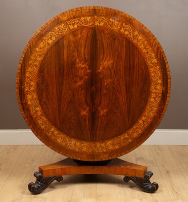 Lot 262 - A William IV and later rosewood tilt-top dining table