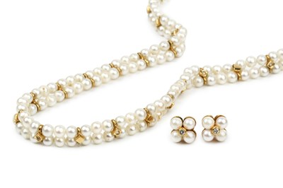 Lot 289 - An 18ct gold and cultured pearl twin strand...