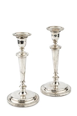 Lot 909 - A pair of silver candlesticks, with reeded...