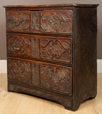 Lot 82 - An antique carved elm chest of drawers