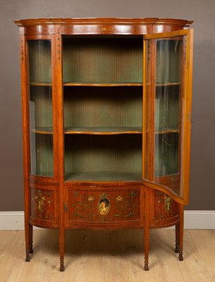 Lot 72 - An Edwardian satinwood serpentine-fronted display cabinet