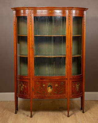 Lot 72 - An Edwardian satinwood serpentine-fronted display cabinet