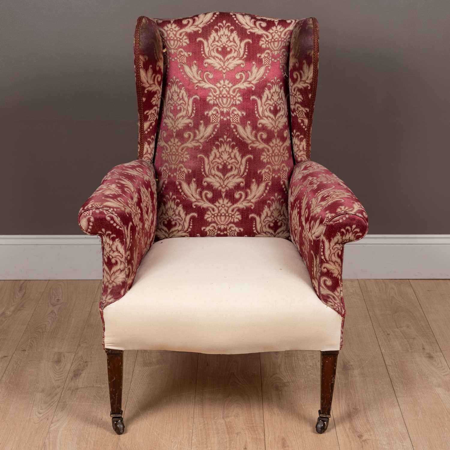 Lot 80 - An Edwardian wingback armchair