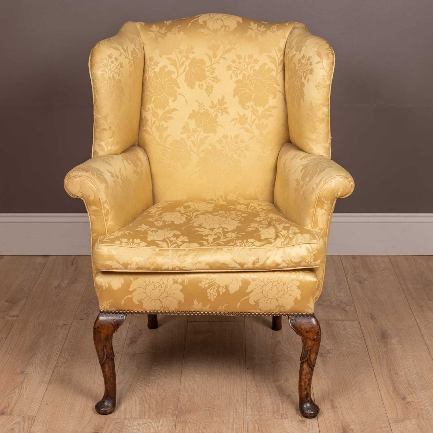 Lot 61 - An antique Georgian style small wingback armchair