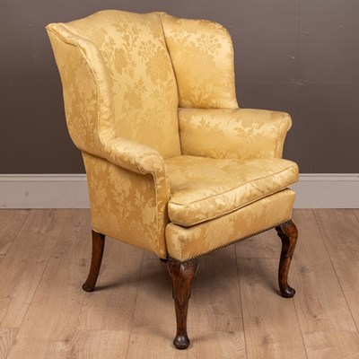 Lot 61 - An antique Georgian style small wingback armchair