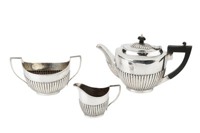 Lot 919 - A matched silver three piece tea service, of...