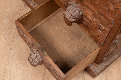 Lot 469 - An ornately carved Victorian oak Davenport