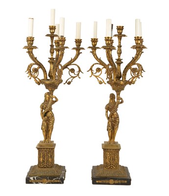 Lot 427 - A pair of brass candelabra