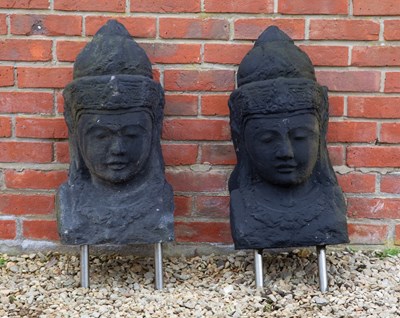 Lot 1251 - A pair of cast reconstituted stone heads in the Oriental style