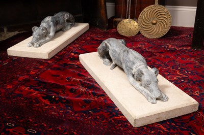 Lot 1016 - A pair of resting greyhounds