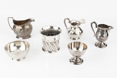 Lot 833 - A George III silver cream jug, embossed with...