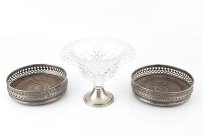 Lot 834 - A pair of silver bottle coasters, with pierced...