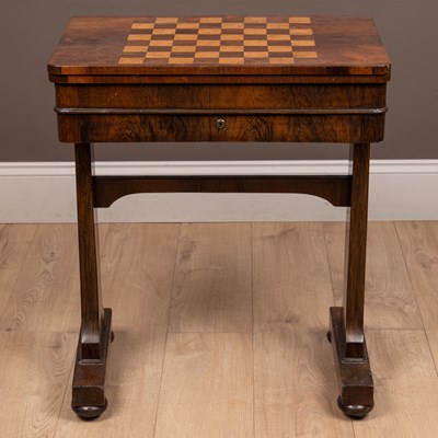 Lot 303 - A 19th century rosewood fold-over games table