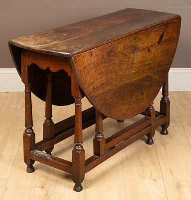 Lot 1069 - A 17th or 18th century oak gateleg table