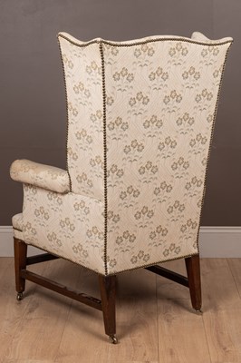 Lot 487 - A Georgian style wingback armchair
