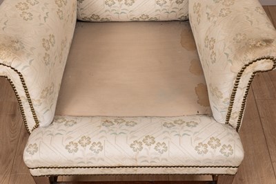 Lot 487 - A Georgian style wingback armchair
