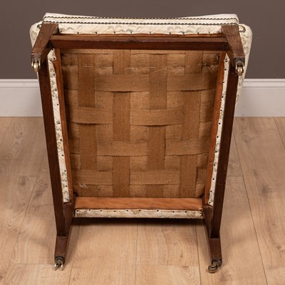Lot 487 - A Georgian style wingback armchair