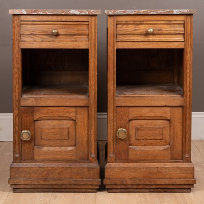 Lot 266 - A two Continental oak marble-topped pot cupboards