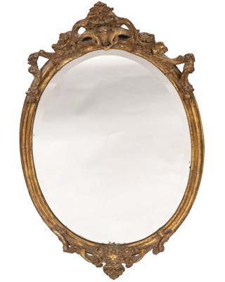 Lot 497 - An oval gilt wall mirror