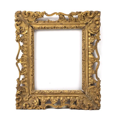 Lot 455 - An 18th century giltwood frame of swept rococo...