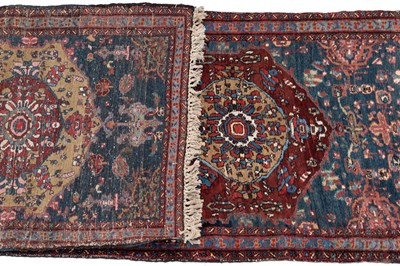 Lot 1090 - An early 20th century hand-woven Heriz runner