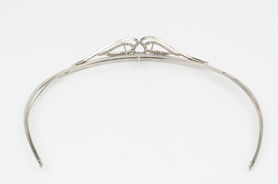 Lot 255 - A diamond set tiara, of shaped and curved...