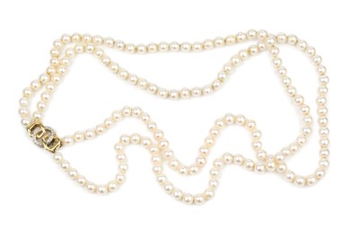 Lot 256 - A twin strand uniform cultured pearl necklace,...