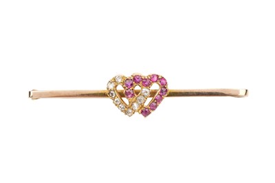 Lot 260 - A 9ct gold diamond and ruby bar brooch, of...