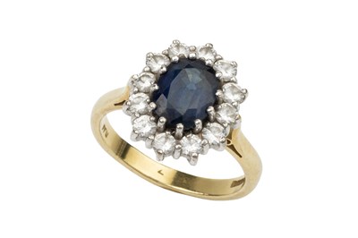 Lot 266 - A sapphire and diamond cluster ring, the oval...