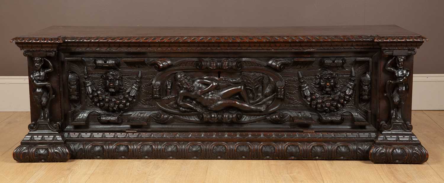 Lot 52A - An Italian walnut cassone with a figurally...